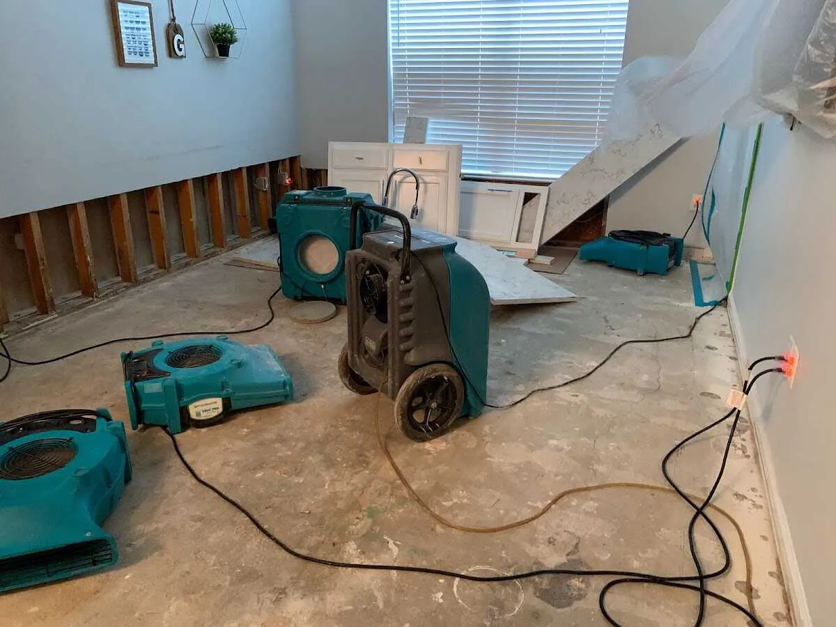 Dehumidifier in flood-cut room for Water Damage Restoration in West University Place
